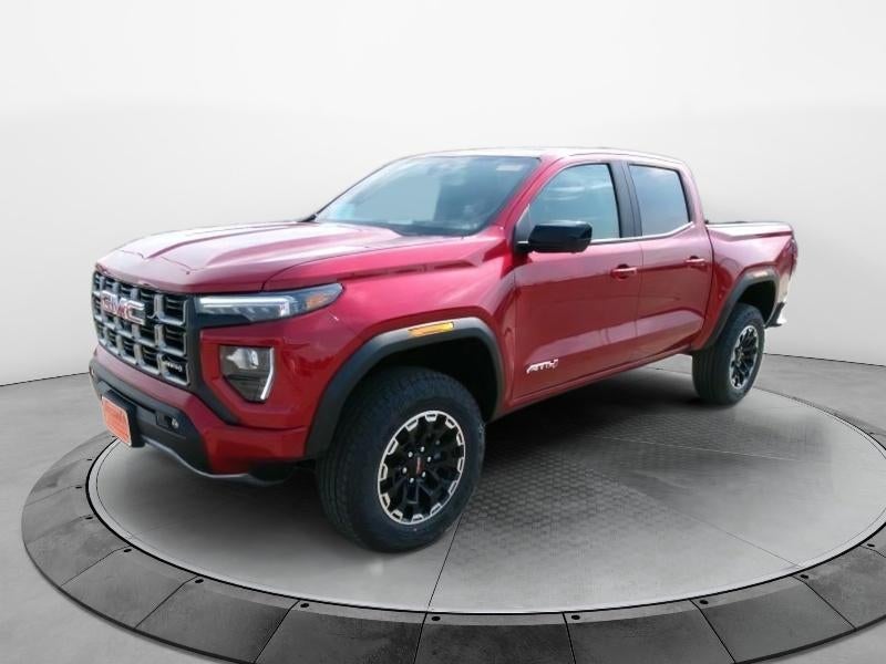 2026 GMC Canyon AT4 in Volcanic Red Tintcoat — front three-quarter view