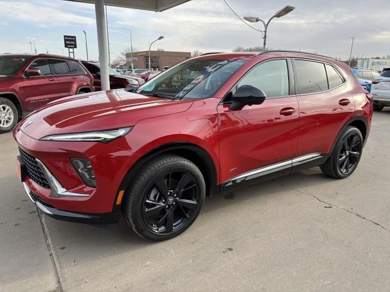 2025 Buick Envision Sport Touring in Brilliant Red — front three-quarter view